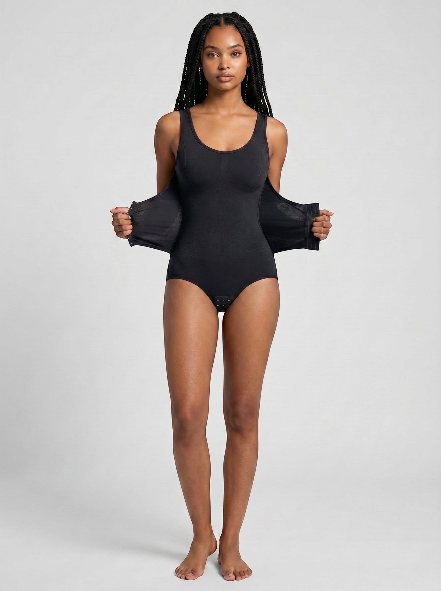 Model wearing a black bys-store-3136505-215991 ZipForm bodysuit with a built-in zipper waist trainer for tummy control.