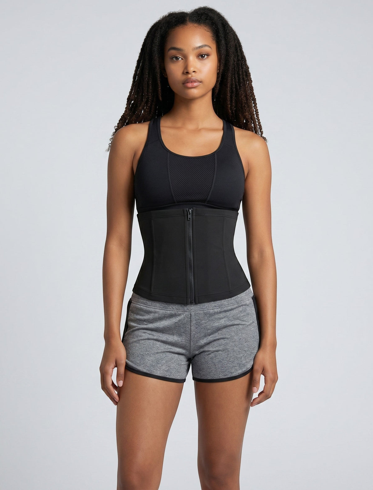 bys-store-3136505-215991 CoreBelt sauna trainer waist trimmer in black worn by a woman for workout support