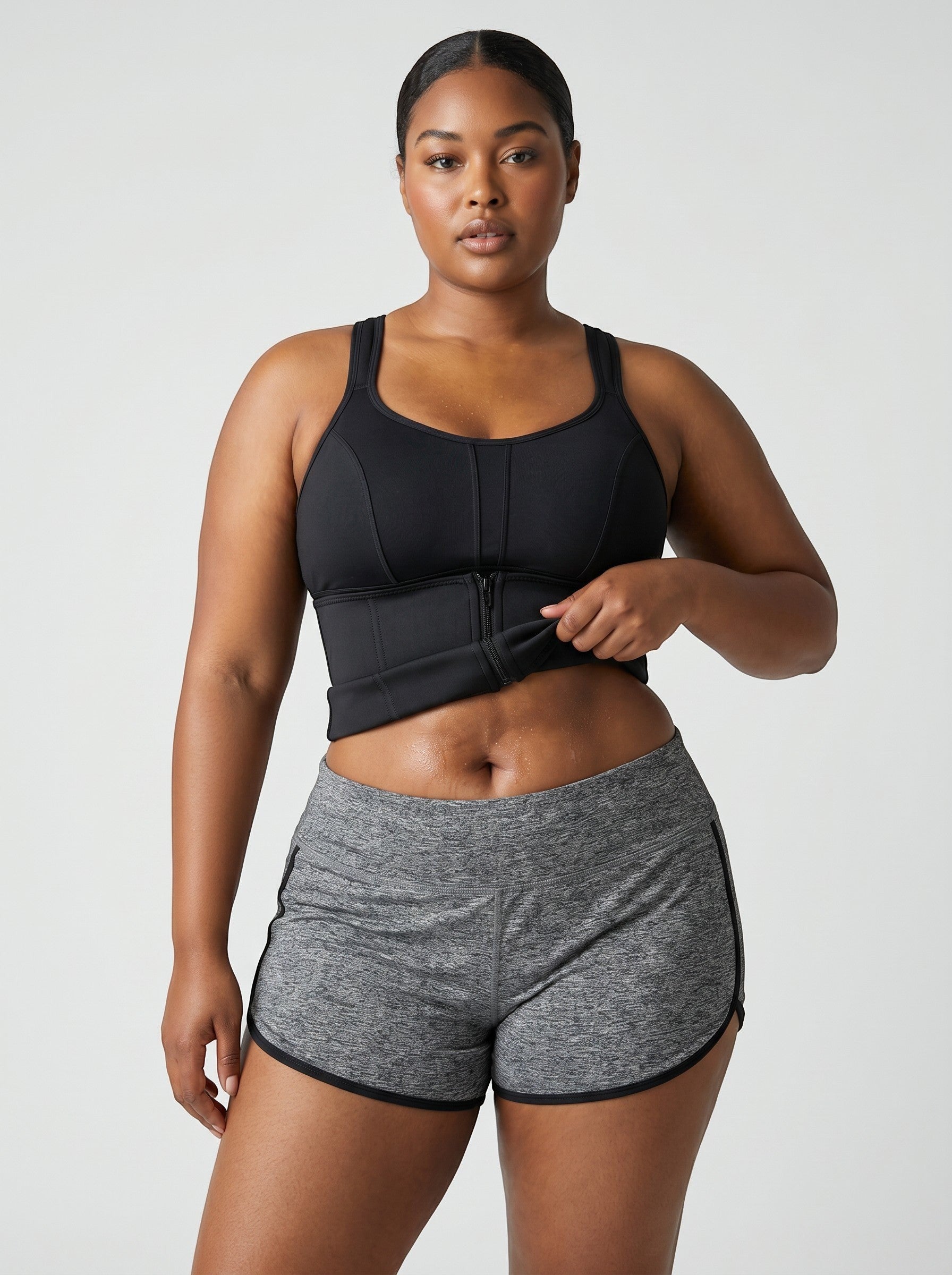 bys-store-3136505-215991 CoreBelt sauna waist trainer in black worn by a woman in athletic shorts