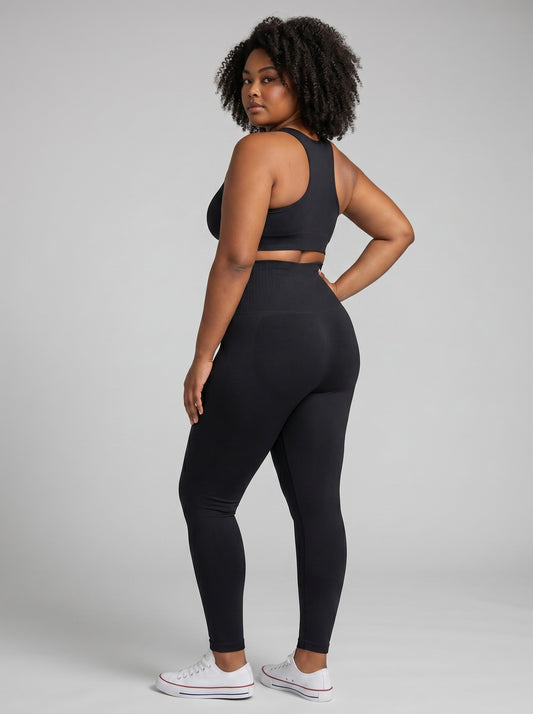 Model wearing bys-store-3136505-215991 SlimForm high-waist black compression leggings and matching sports bra