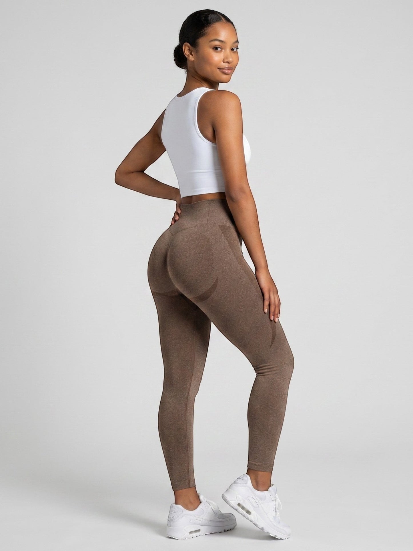 bys-store-3136505-215991 brown seamless high-waist gym leggings with booty contouring worn by a woman
