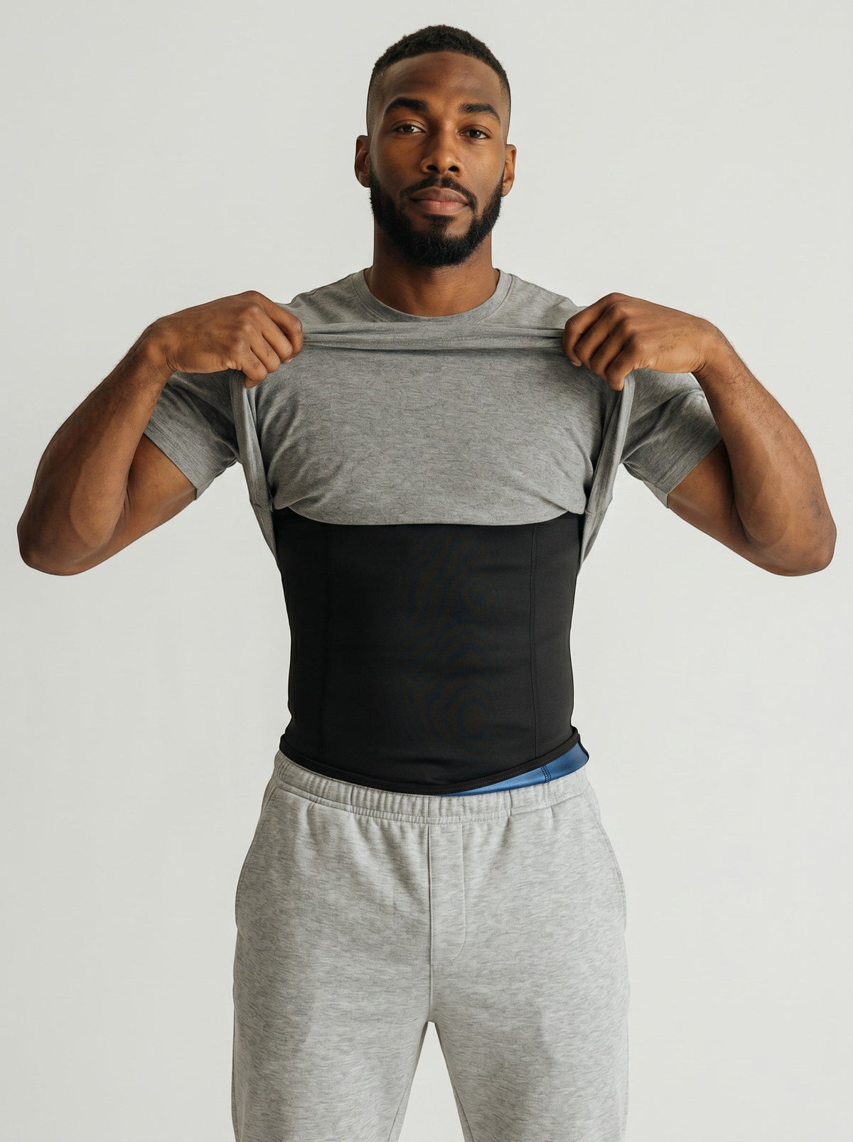 bys-store-3136505-215991 BurnCore black sauna waist trimmer belt worn by a man under a grey t-shirt for core support.