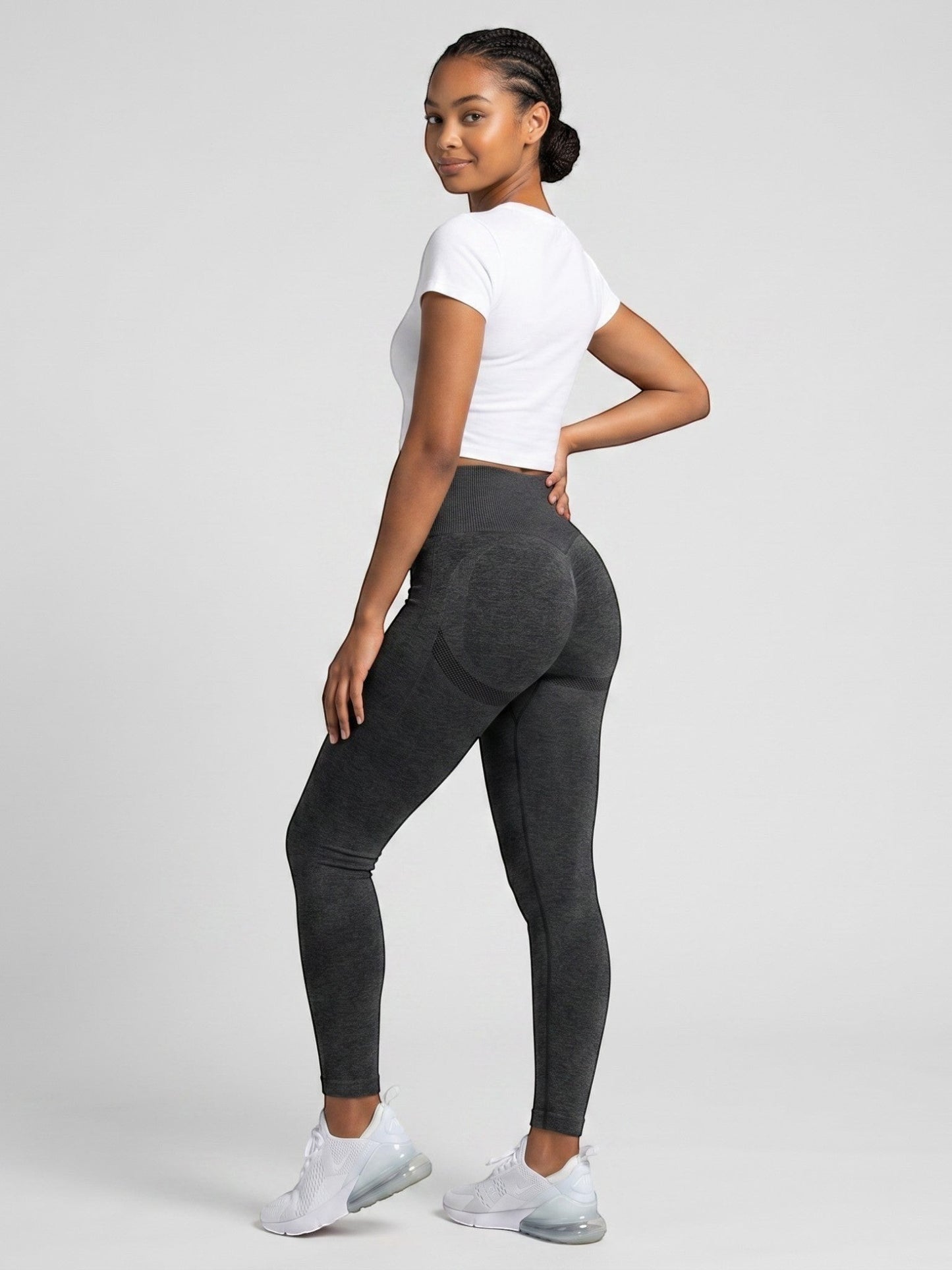 Model wearing dark grey ContourFlex high-waist seamless leggings with booty contouring for gym and yoga bys-store-3136505-215991