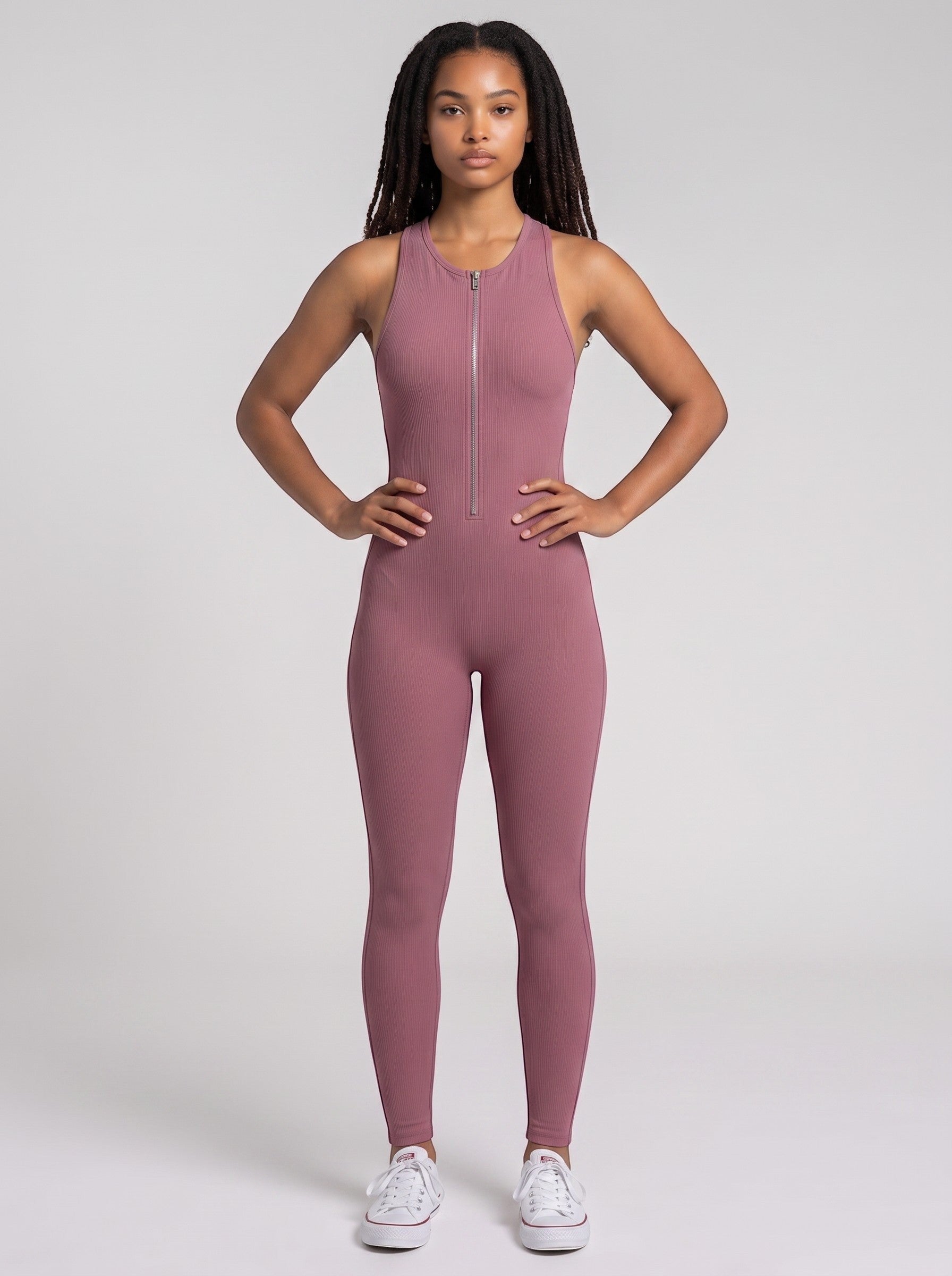 Model wearing a mauve ribbed SculptFit Bodysuit by bys-store-3136505-215991 with a front zipper and racerback design.