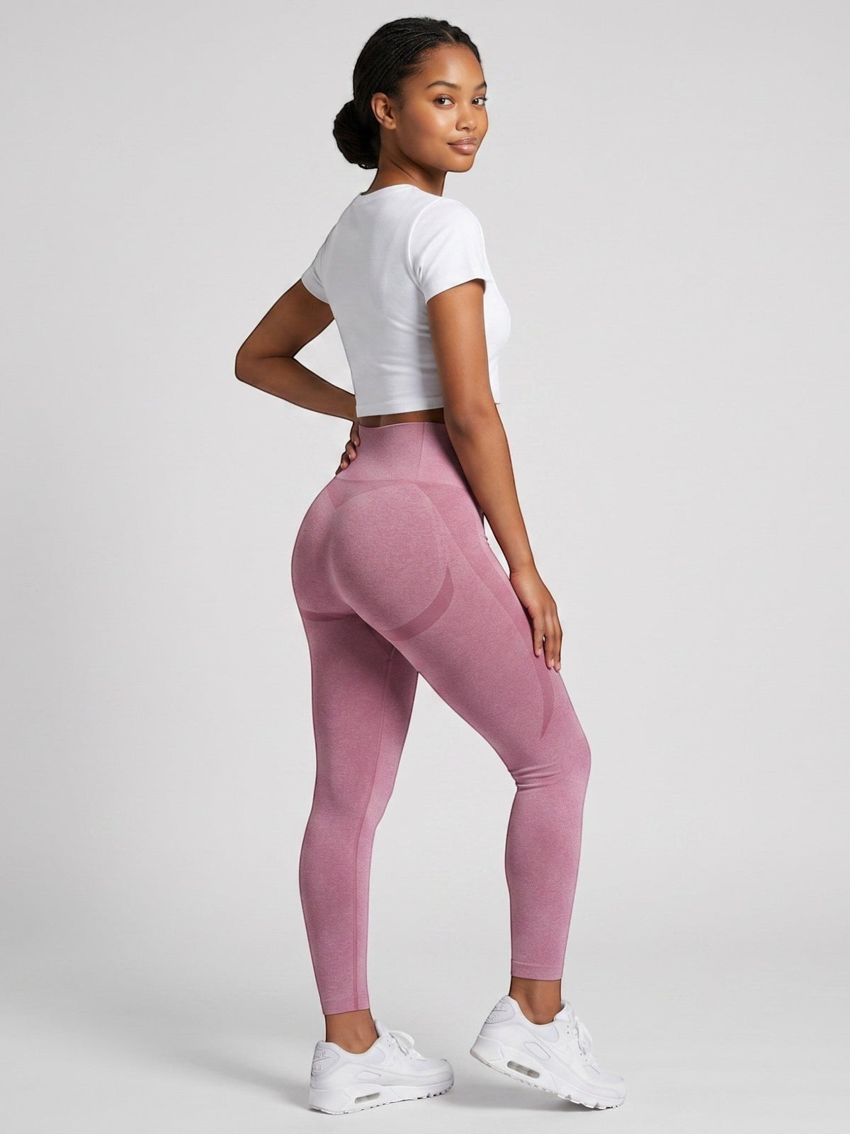 bys-store-3136505-215991 pink seamless high-waist gym leggings with booty contouring on a model wearing a white top
