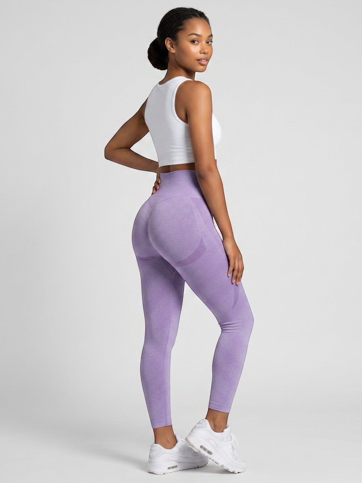 Model wearing bys-store-3136505-215991 purple seamless high-waist gym leggings with butt-lifting contouring design